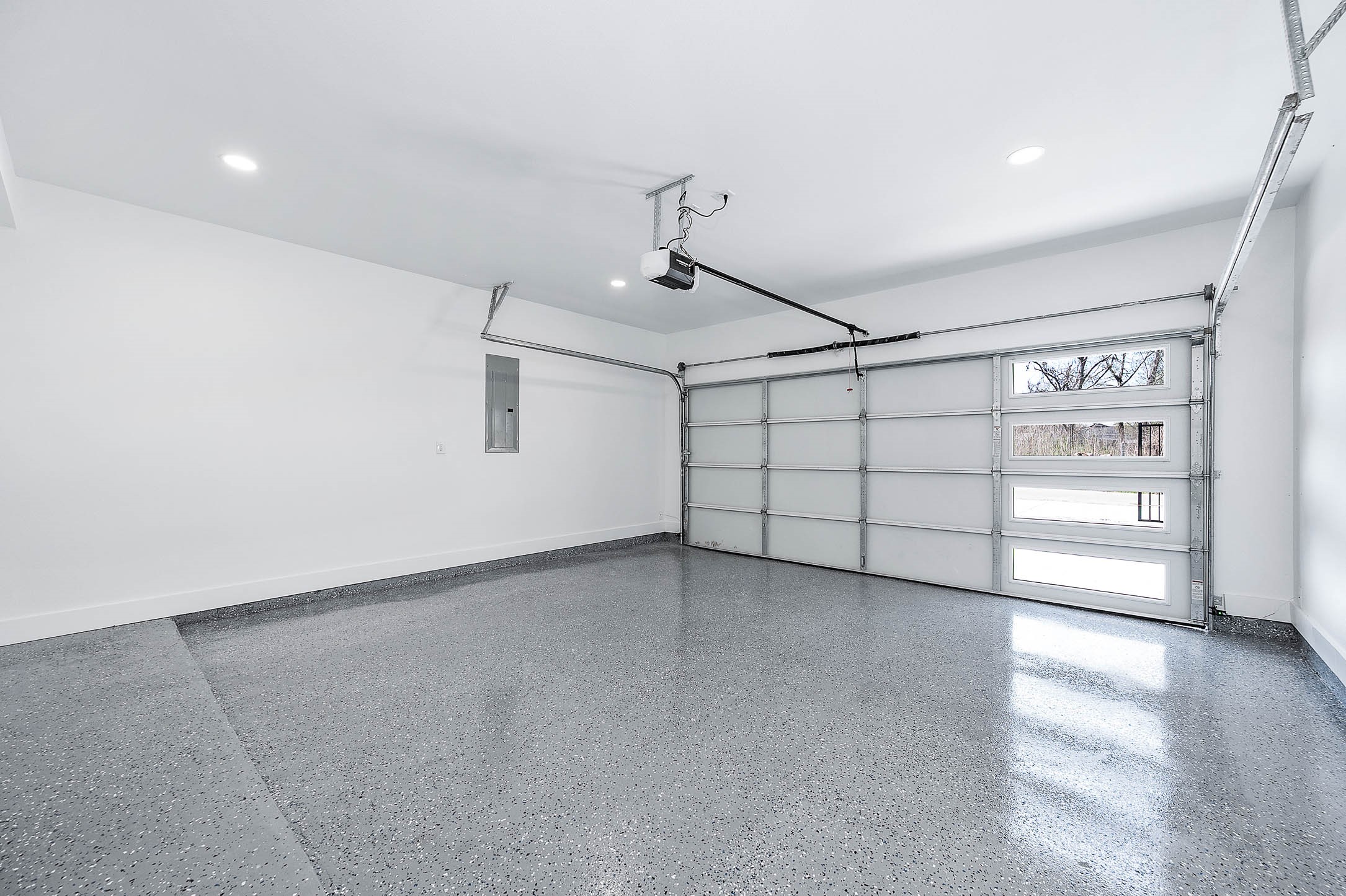 8602 Hoffman Street Houston, TX 77016 - Photo 13 of 30 Spacious two-car garage featuring epoxy flooring and a clean, finished interior.