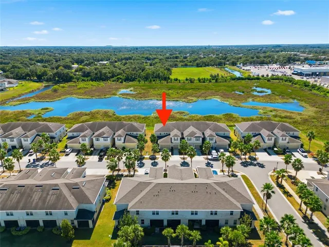 an aerial view of residential houses with outdoor space