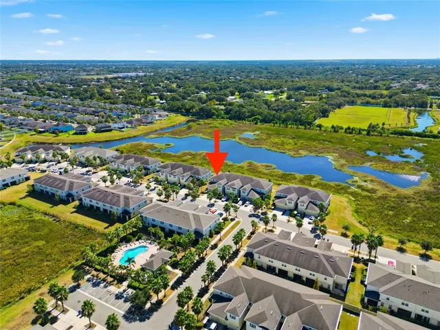 an aerial view of residential houses with outdoor space