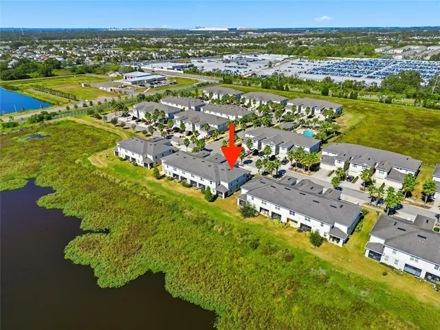 an aerial view of residential houses with outdoor space