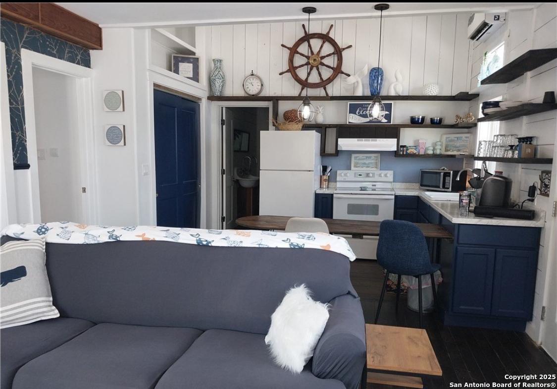 71 Avril Drive Port Lavaca, TX 77979 - Photo 11 of 19 a living room with stainless steel appliances kitchen island granite countertop furniture and a fireplace