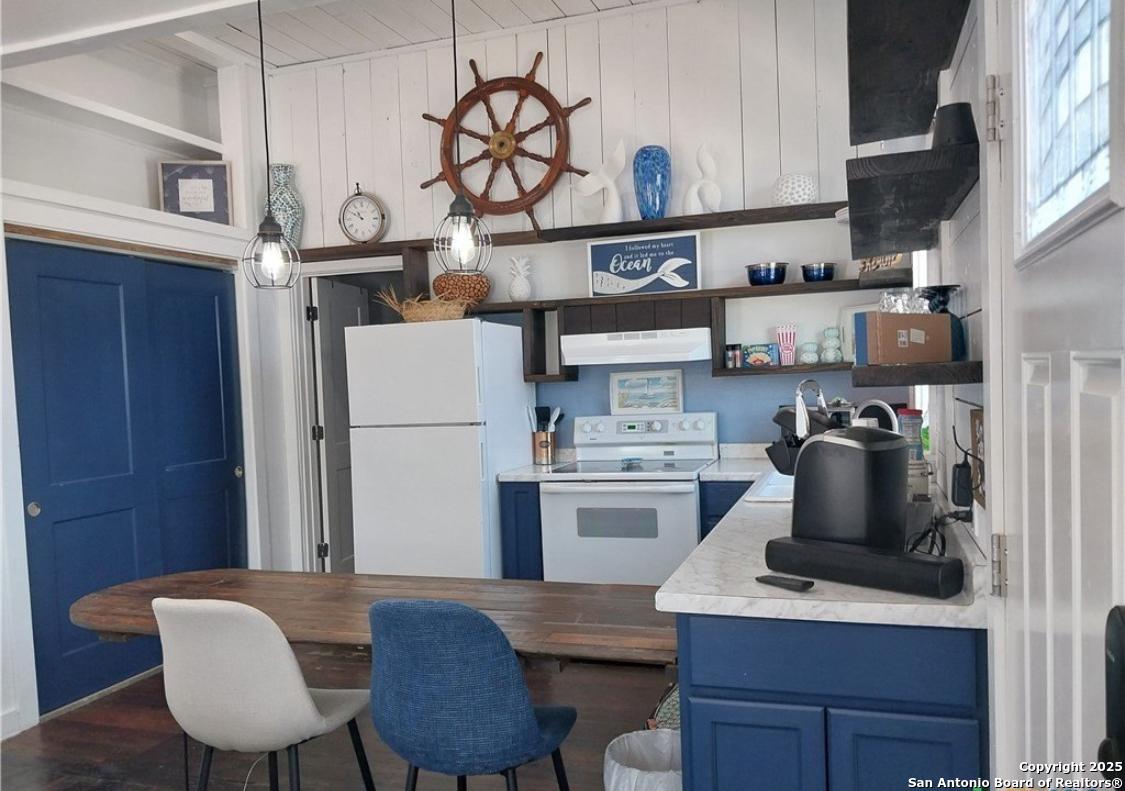 71 Avril Drive Port Lavaca, TX 77979 - Photo 12 of 19 a kitchen with cabinets and wooden floor