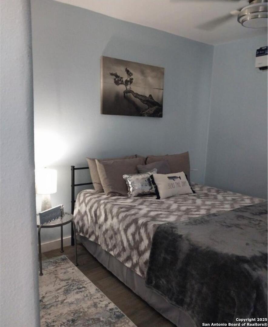 71 Avril Drive Port Lavaca, TX 77979 - Photo 18 of 19 a bed sitting in a bedroom next to a lamp