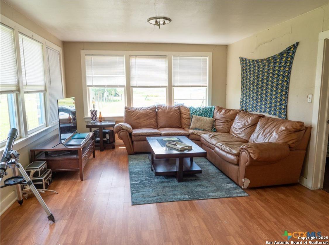 71 Avril Drive Port Lavaca, TX 77979 - Photo 3 of 19 a living room with furniture wooden floor and a large window