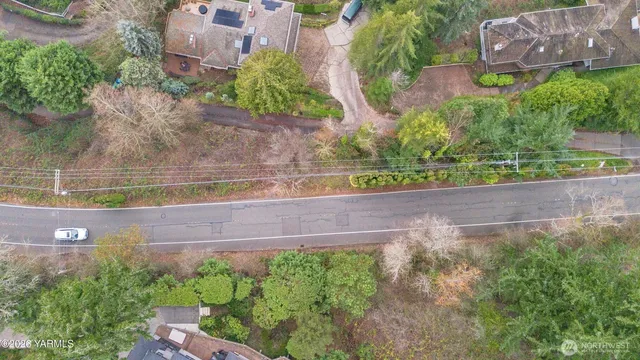 an aerial view of a house with a yard and a garden