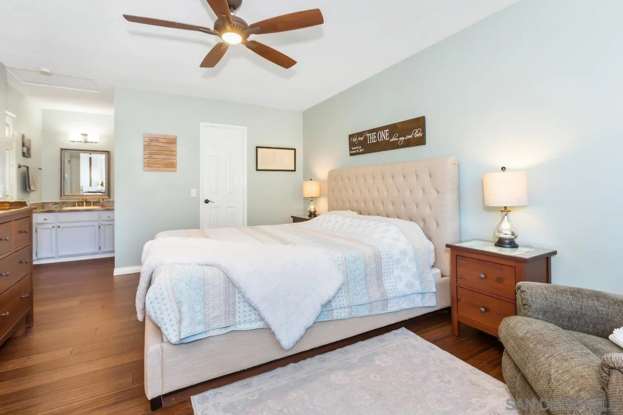 28423 Wimbleton Lane Escondido, CA 92026 - Photo 15 of 25 a bedroom with a bed and wooden floor