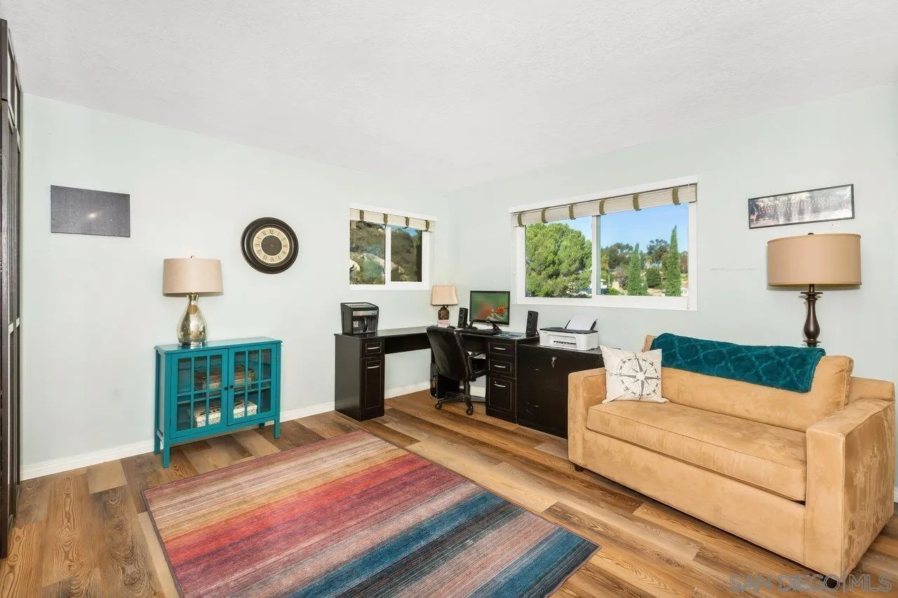28423 Wimbleton Lane Escondido, CA 92026 - Photo 18 of 25 a living room with furniture and a window