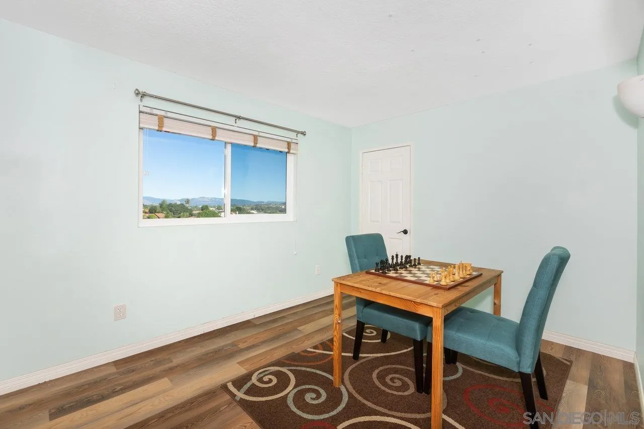 28423 Wimbleton Lane Escondido, CA 92026 - Photo 19 of 25 a view of a room with furniture and wooden floor