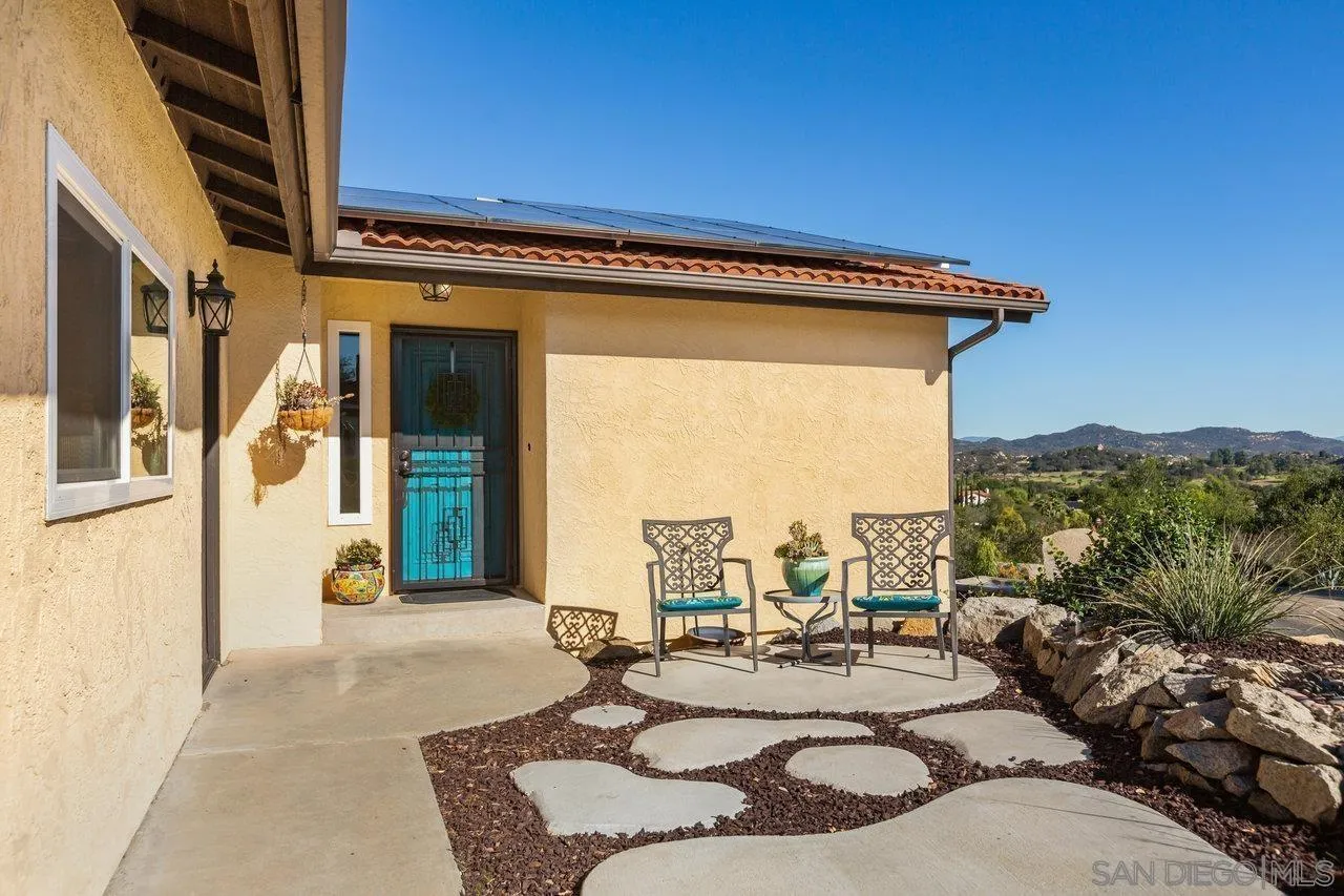 28423 Wimbleton Lane Escondido, CA 92026 - Photo 2 of 25 a view of a patio with couches and potted plants