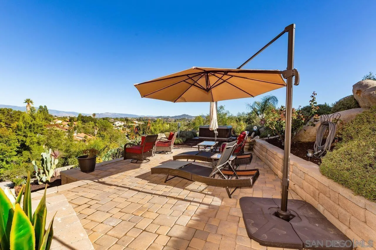 28423 Wimbleton Lane Escondido, CA 92026 - Photo 22 of 25 a view of a terrace with furniture and umbrella