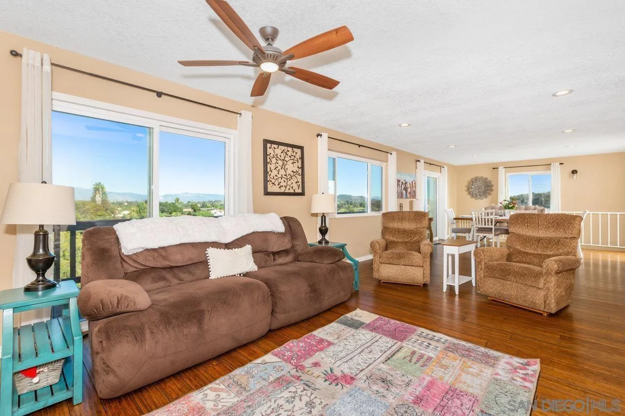 28423 Wimbleton Lane Escondido, CA 92026 - Photo 4 of 25 a living room with furniture and a wooden floor