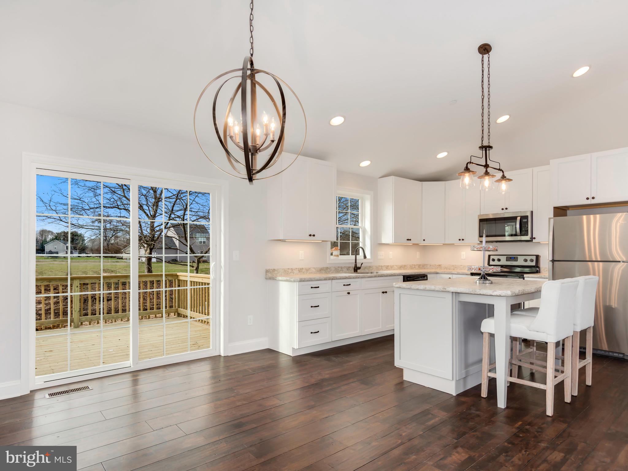 24626 Tribbett Circle Ridgely, MD 21660 - Photo 6 of 28 Dining area overlooking backyard