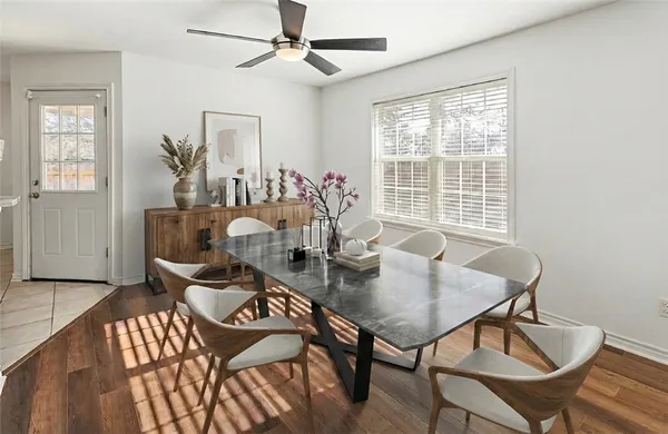 a view of a dining room with furniture window and outside view