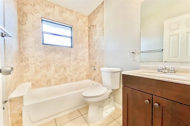 a bathroom with a sink a toilet and a bathtub