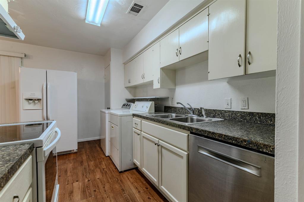 3213 Thames Street Irving, TX 75062 - Photo 11 of 25 a kitchen with stainless steel appliances granite countertop a sink stove and refrigerator
