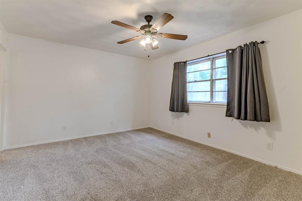 3213 Thames Street Irving, TX 75062 - Photo 13 of 25 a view of an empty room with a window
