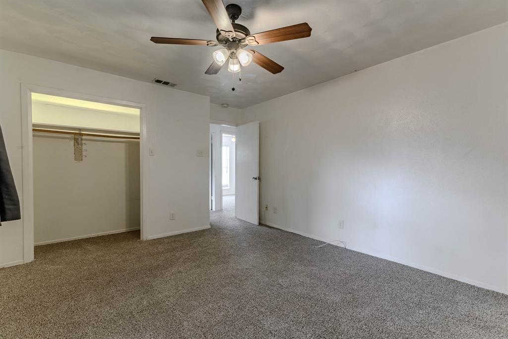 3213 Thames Street Irving, TX 75062 - Photo 15 of 25 an empty room with chandelier fan