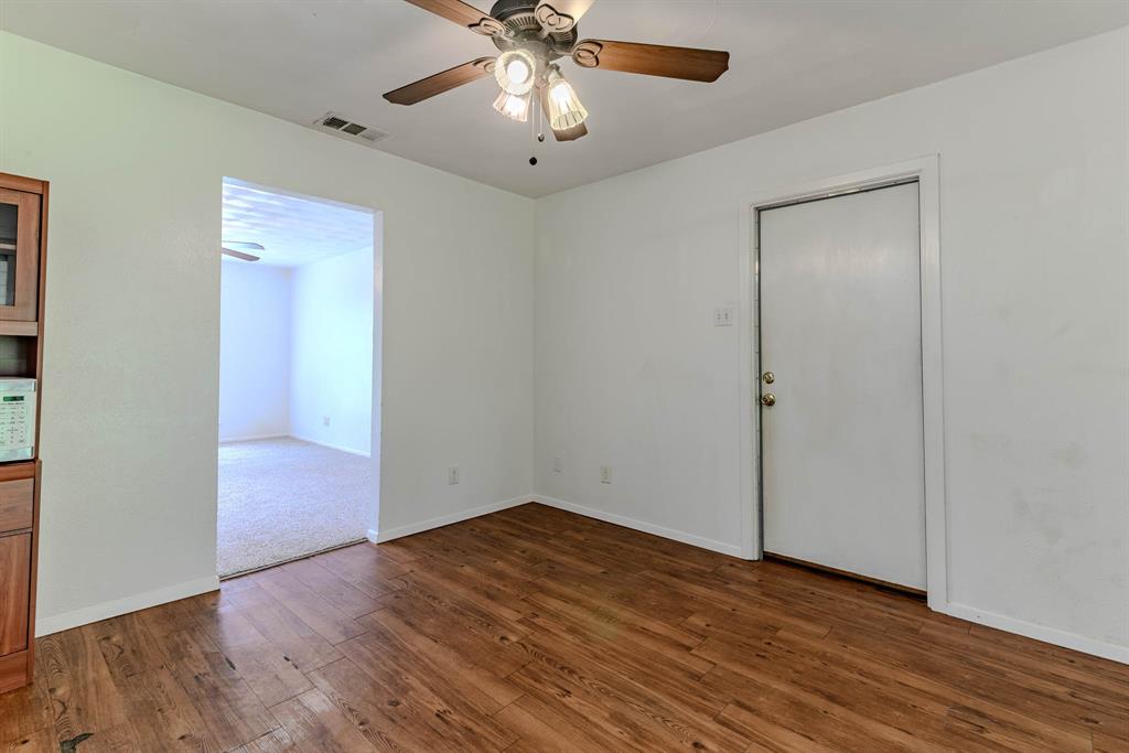 3213 Thames Street Irving, TX 75062 - Photo 8 of 25 a view of empty room with wooden floor