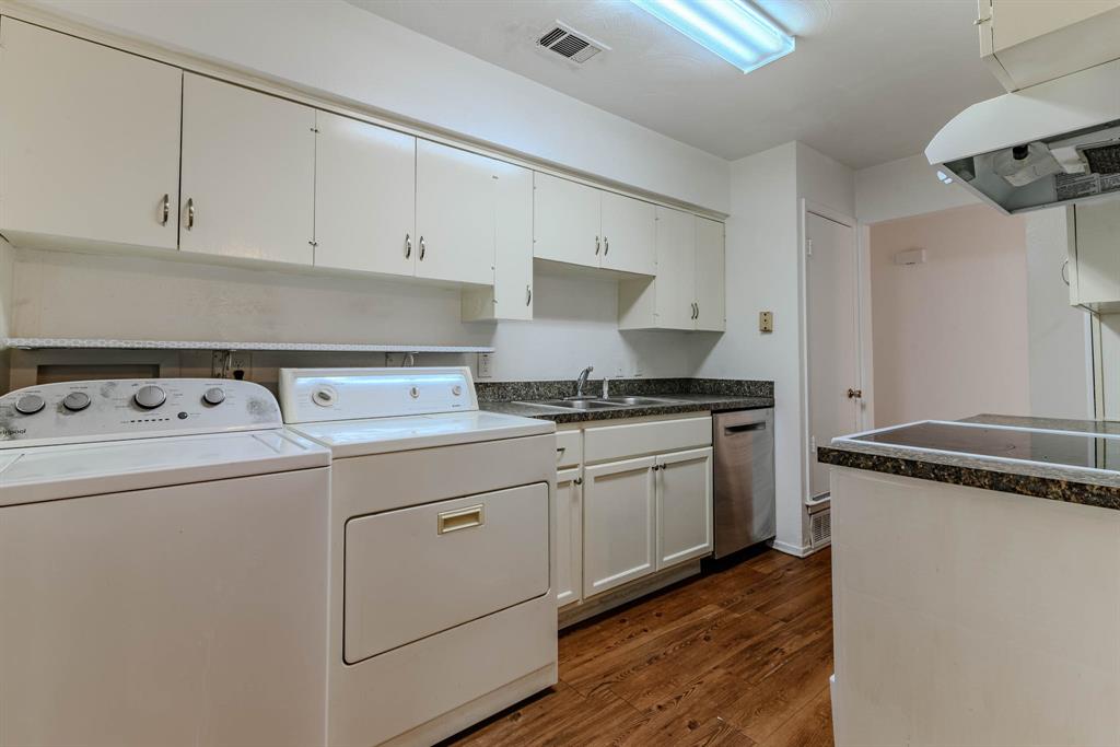 3213 Thames Street Irving, TX 75062 - Photo 9 of 25 a kitchen with granite countertop a sink and a stove top oven
