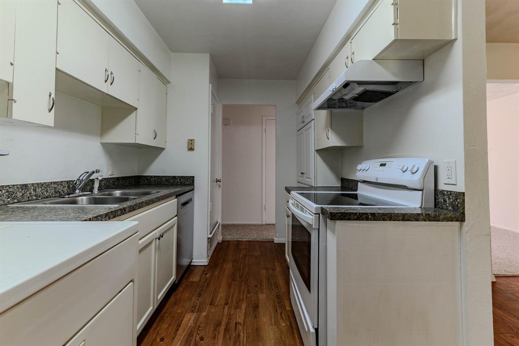 3213 Thames Street Irving, TX 75062 - Photo 10 of 25 a kitchen with a stove and a sink