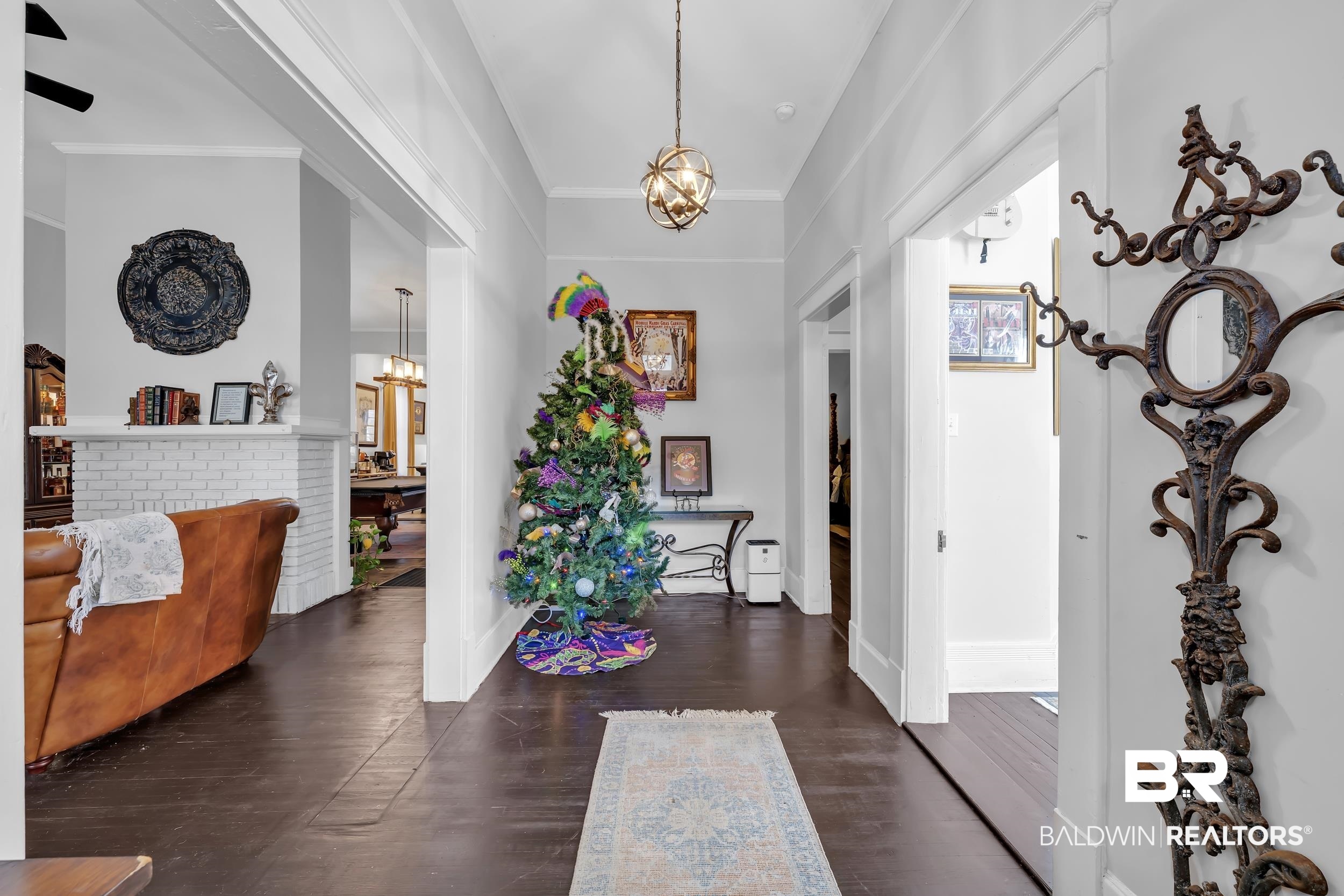 1322 Dauphin Street Mobile, AL 36604 - Photo 5 of 21 Entryway with suspended lighting, crown molding, and dark wood-style floors