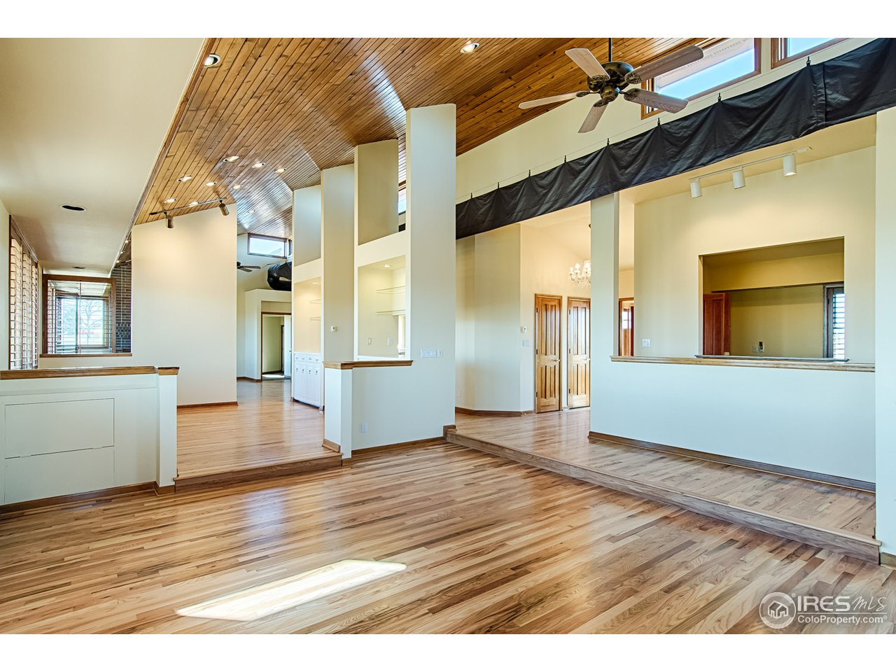 7412 Rodeo Drive Longmont, CO 80504 - Photo 5 of 25 Wood Floors and Vaulted Ceilings