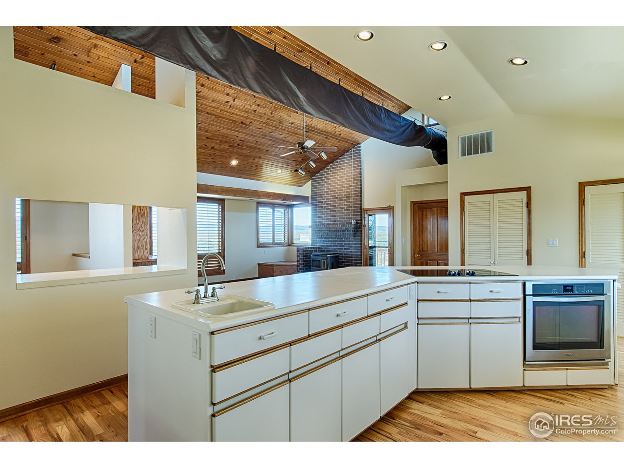 7412 Rodeo Drive Longmont, CO 80504 - Photo 7 of 25 View of Family Room with Stove from Kitchen