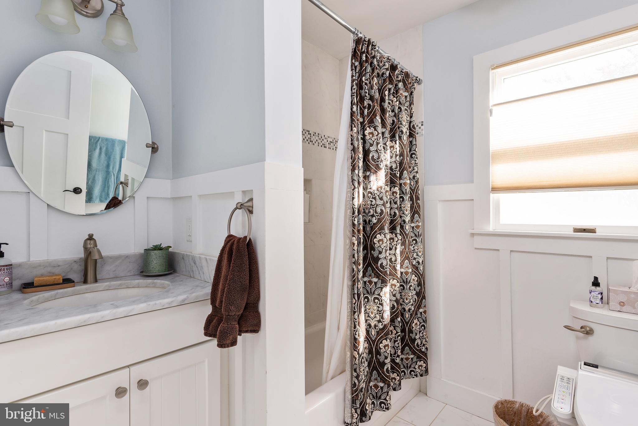 602 Old Point Road Chester, MD 21619 - Photo 16 of 51 a bathroom with a sink a toilet and a mirror