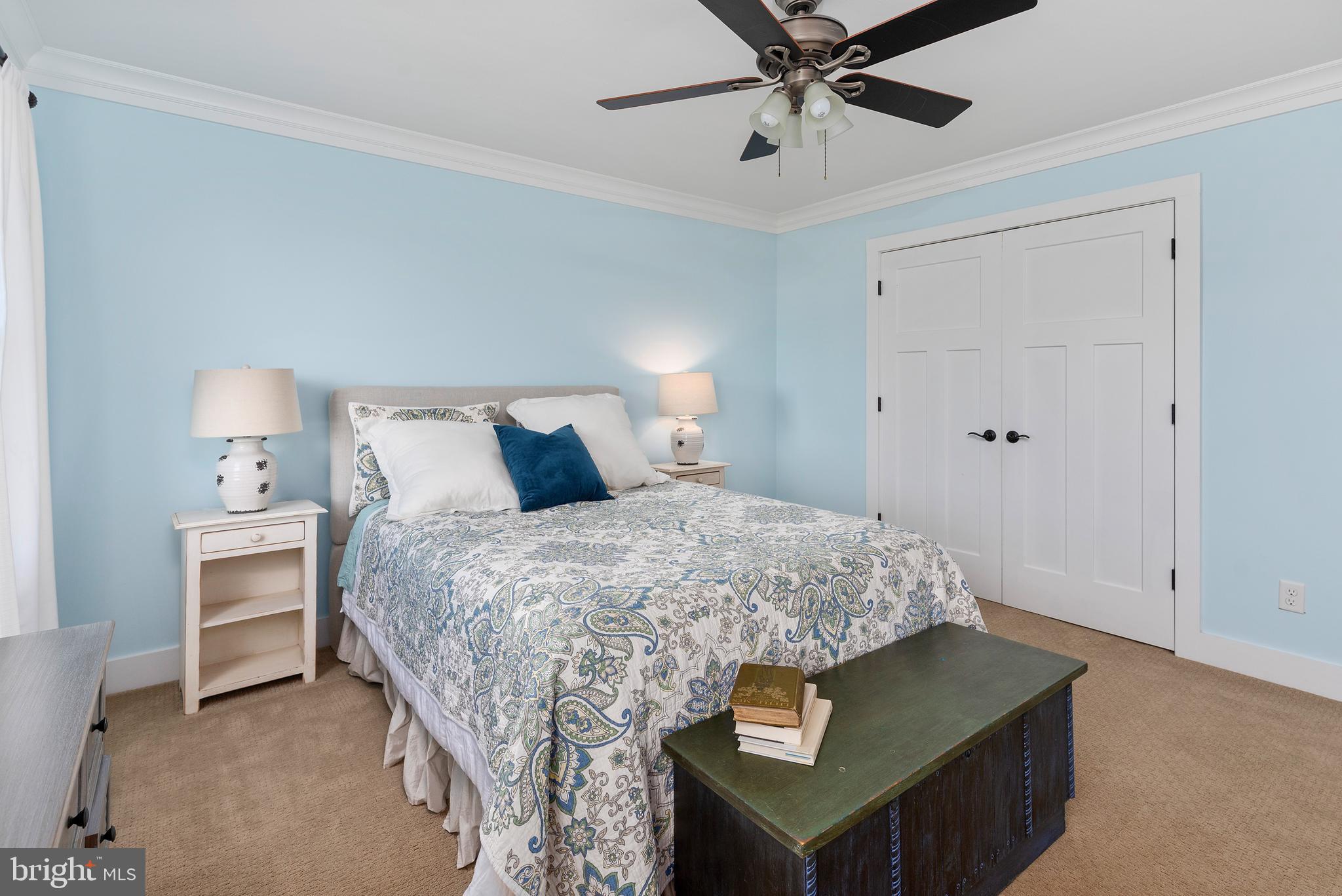 602 Old Point Road Chester, MD 21619 - Photo 28 of 51 a bedroom with a bed and a chandelier