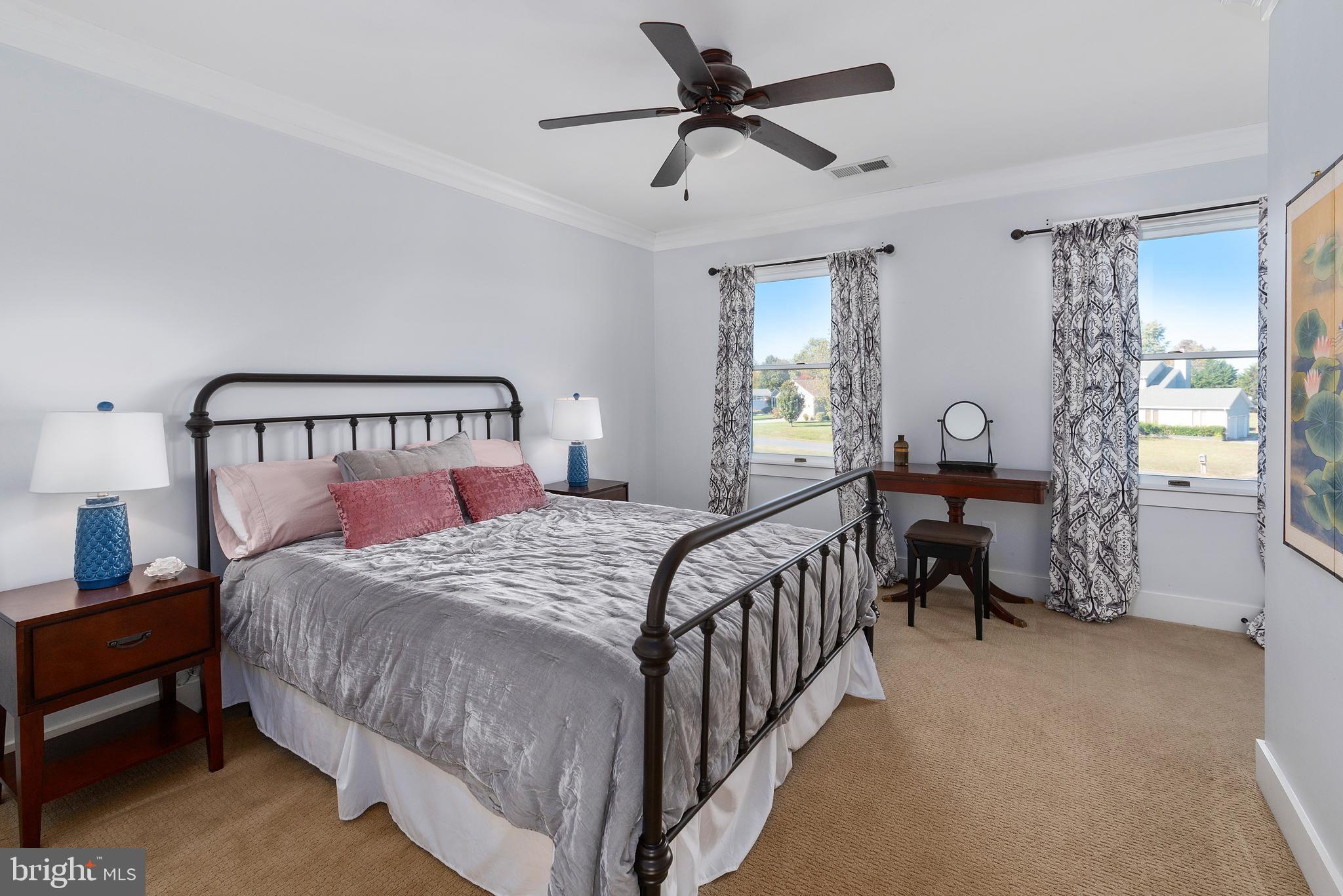 602 Old Point Road Chester, MD 21619 - Photo 29 of 51 a bedroom with a bed and a chandelier
