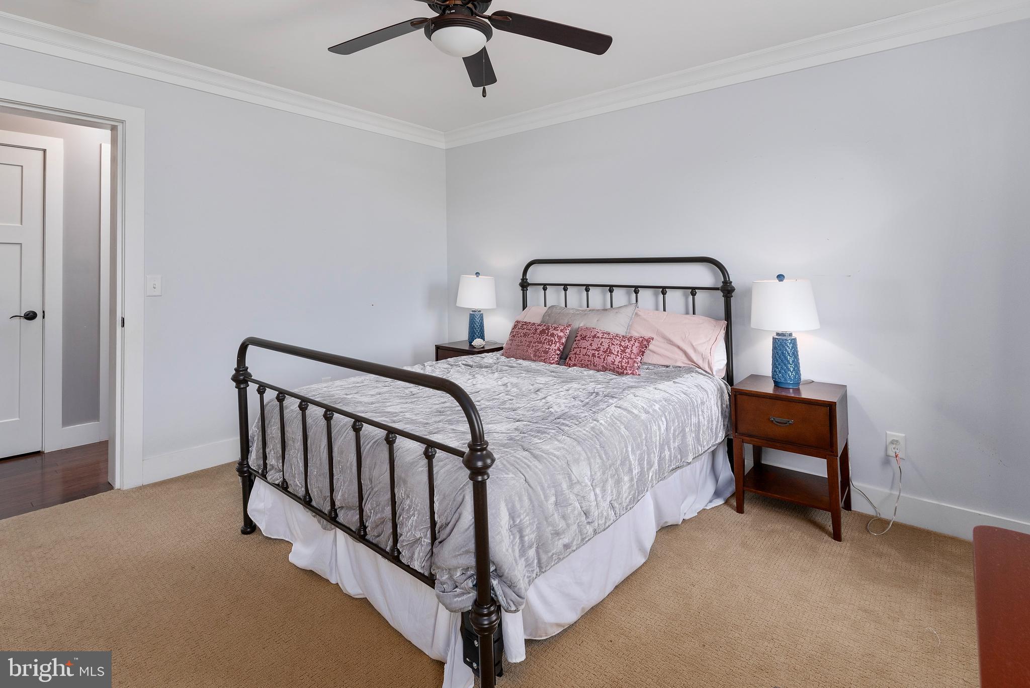 602 Old Point Road Chester, MD 21619 - Photo 30 of 51 a bed room with a bed and a chandelier