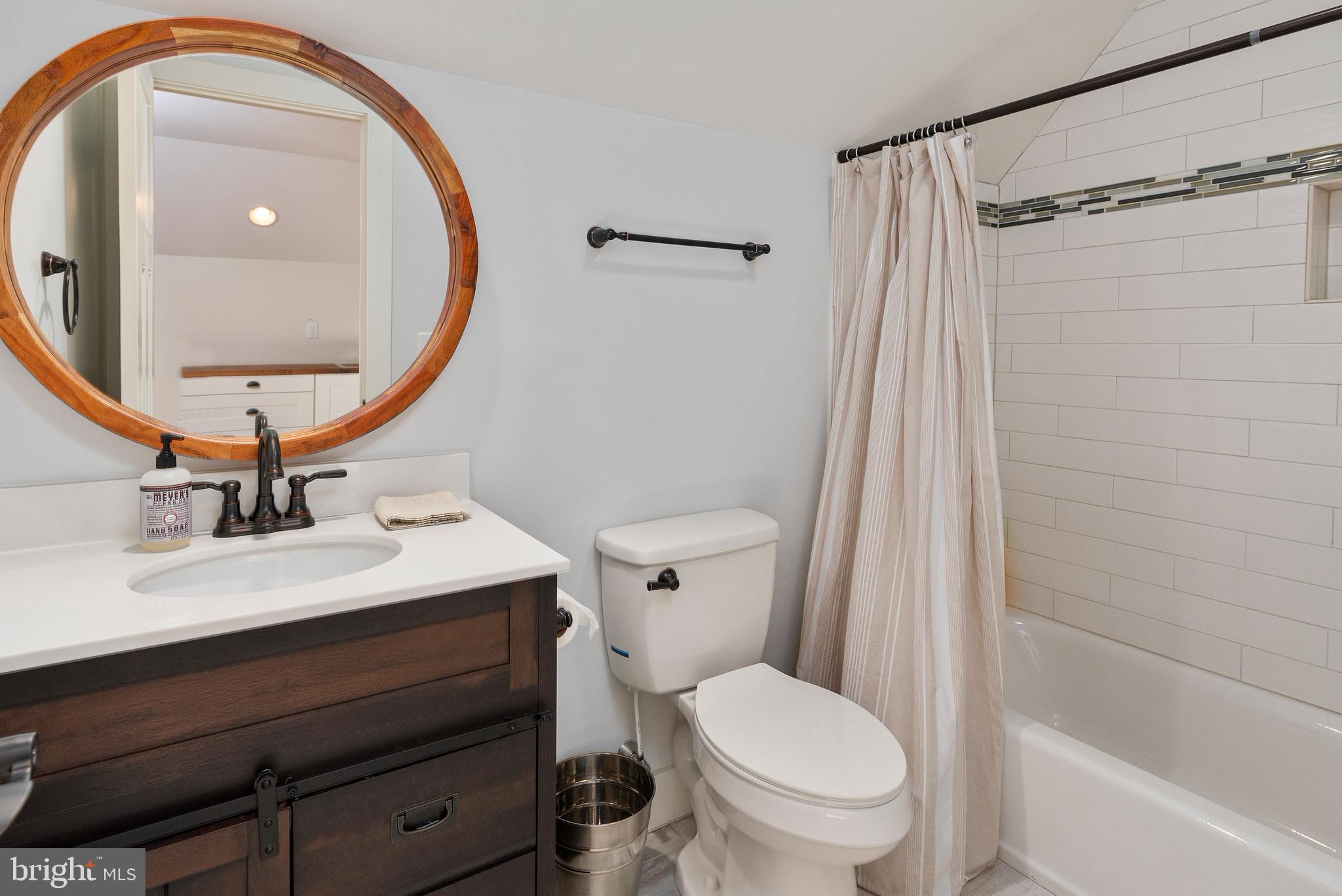602 Old Point Road Chester, MD 21619 - Photo 35 of 51 a bathroom with a sink a toilet and a mirror
