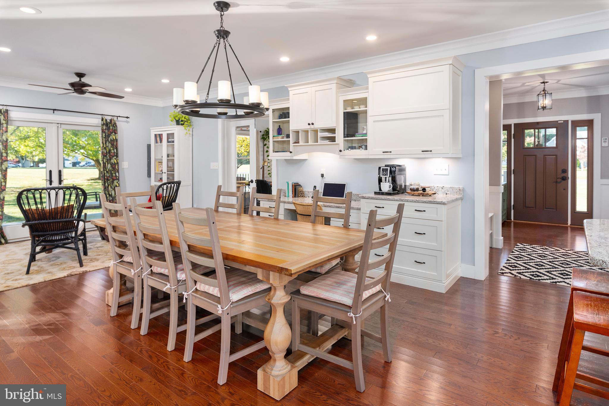 602 Old Point Road Chester, MD 21619 - Photo 9 of 51 a dining room with furniture a chandelier and wooden floor