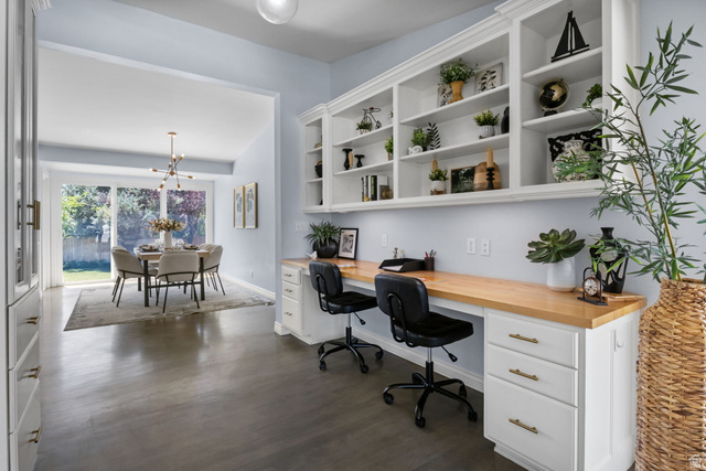 576 East 3950 North Provo, UT 84604 - Photo 16 of 47 Integrated desk area featuring a light wood countertop, white cabinetry with gold-tone hardware, and extensive built-in shelving
