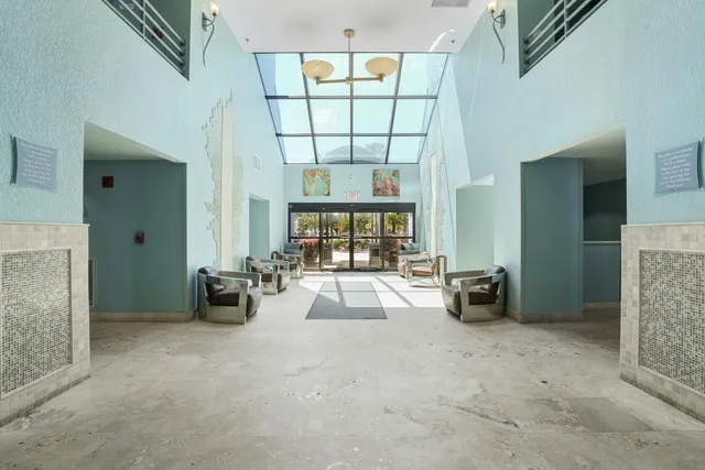an entryway and livingroom with furniture
