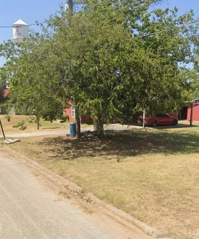 a view of a road with a building in the background