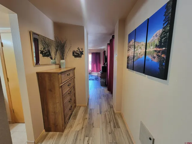 a view of a hallway view with wooden floor