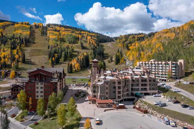a view of a dining room with furniture large windows and wooden floor