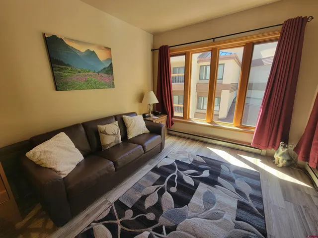 a living room with furniture and a window