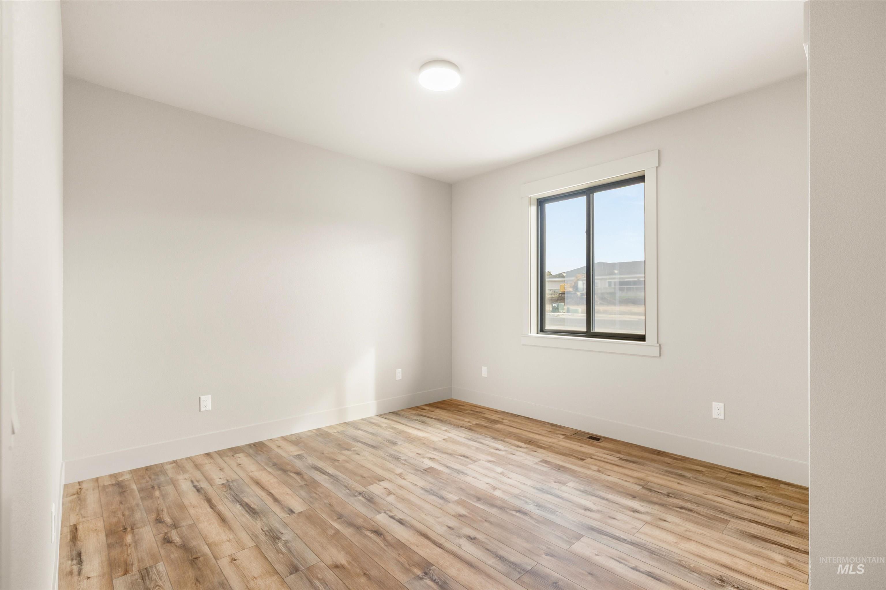 335 Warner Avenue Lewiston, ID 83501 - Photo 33 of 43 Spare room featuring light wood-type flooring and baseboards