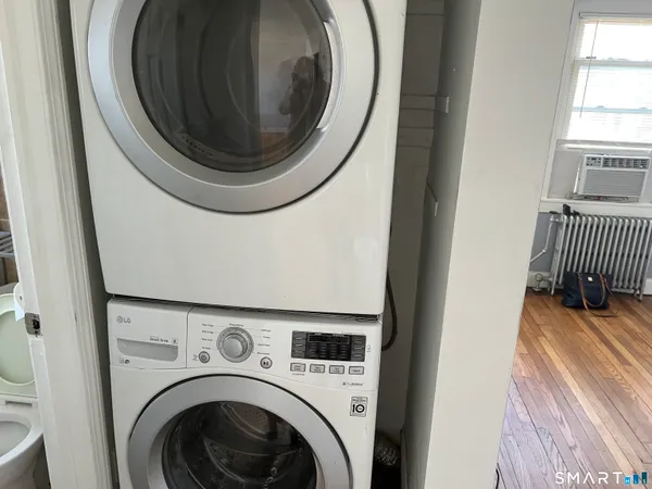 a close up view of a washer and dryer in a utility room