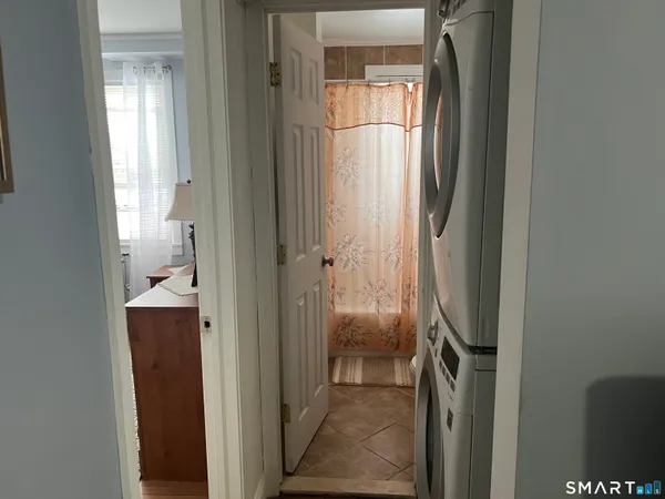 a view of a bathroom from a hallway