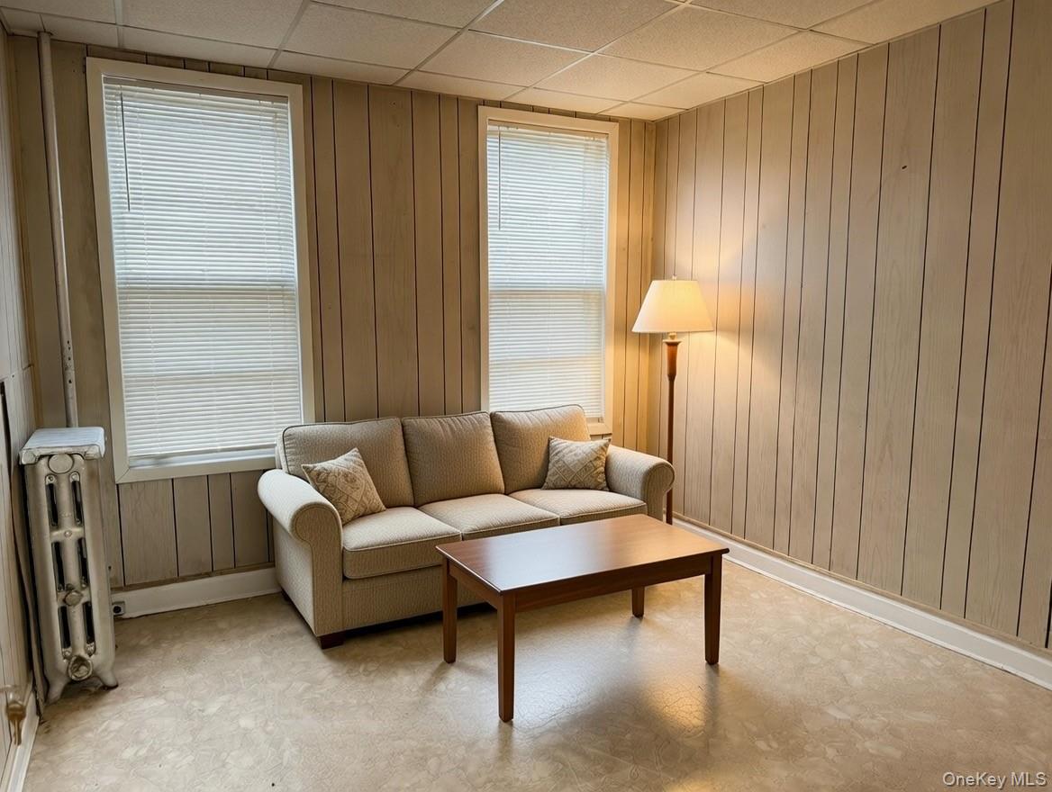 1930 Edison Avenue Bronx, NY 10461 - Photo 4 of 9 a living room with furniture and a window