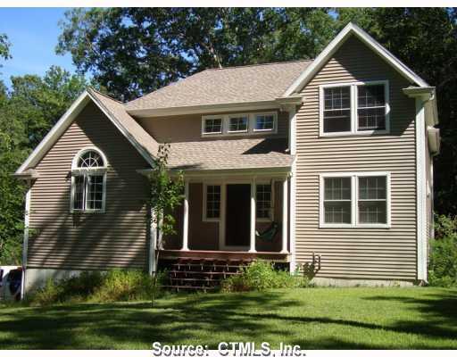 146 Whalehead Road Ledyard, CT 06335 - Photo 1 of 1 a view of a yard in front of a house with plants