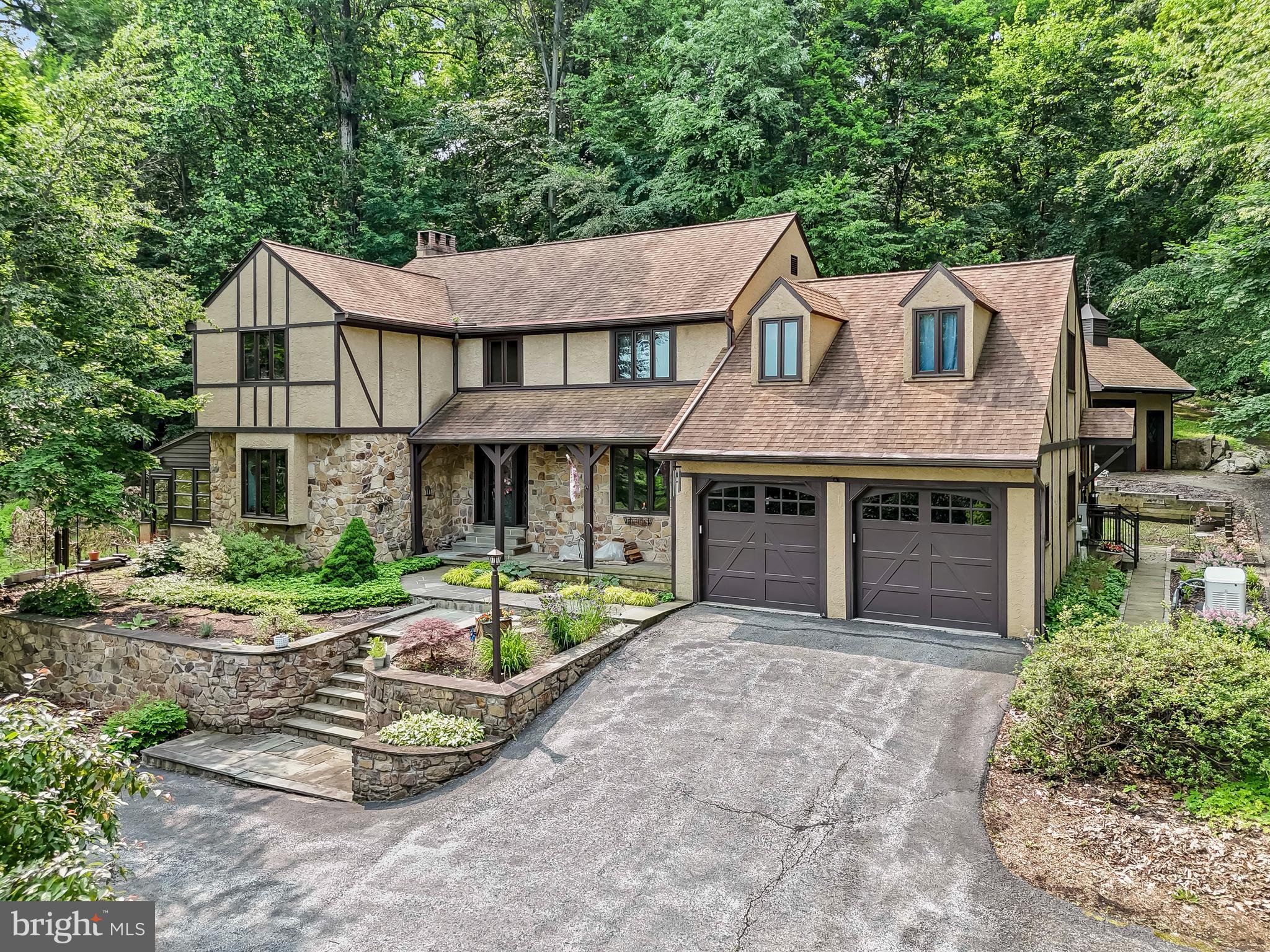 1200 Dunsinane Hill Chester Springs, PA 19425 - Photo 1 of 42 a front view of a house with garden