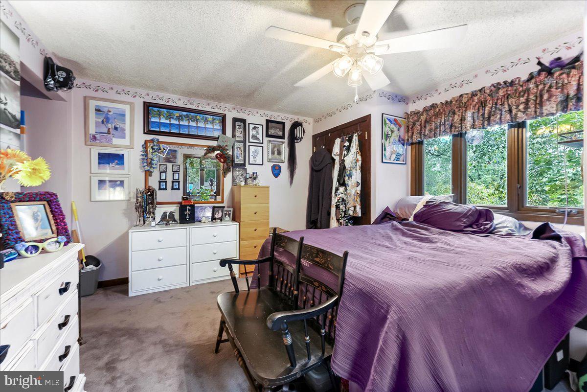 1200 Dunsinane Hill Chester Springs, PA 19425 - Photo 19 of 42 a bed room with a bed and a large window