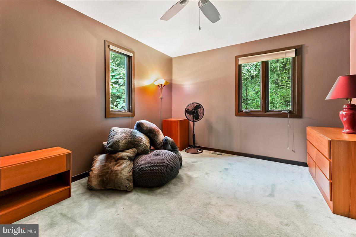 1200 Dunsinane Hill Chester Springs, PA 19425 - Photo 20 of 42 a bedroom with a bed and a window