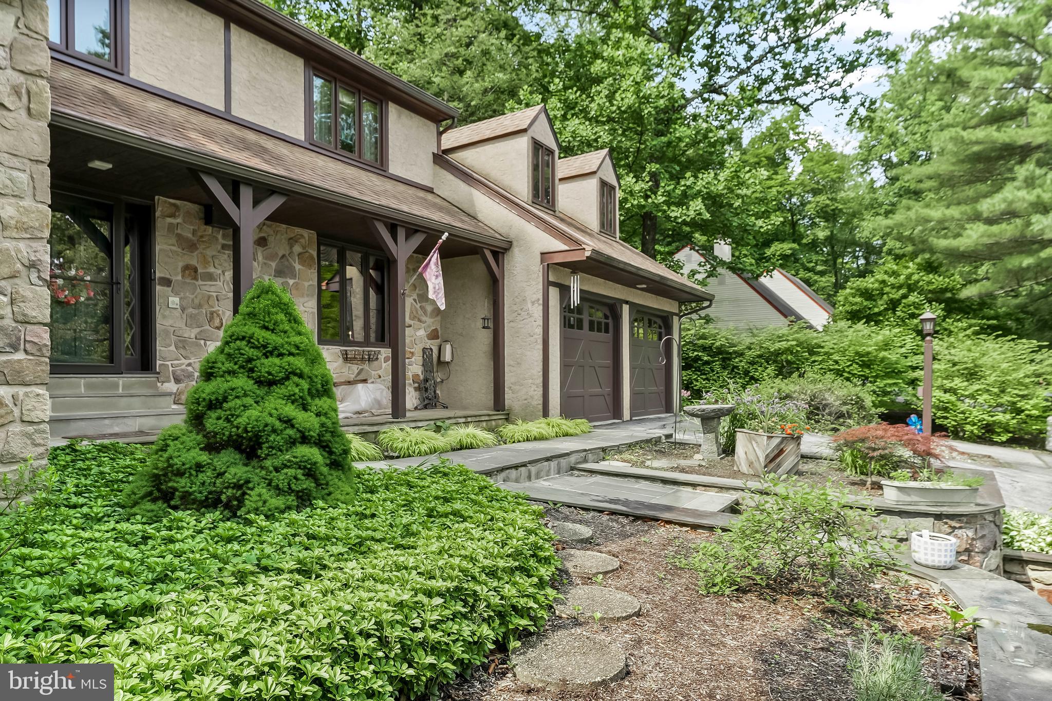 1200 Dunsinane Hill Chester Springs, PA 19425 - Photo 27 of 42 a front view of a house with garden