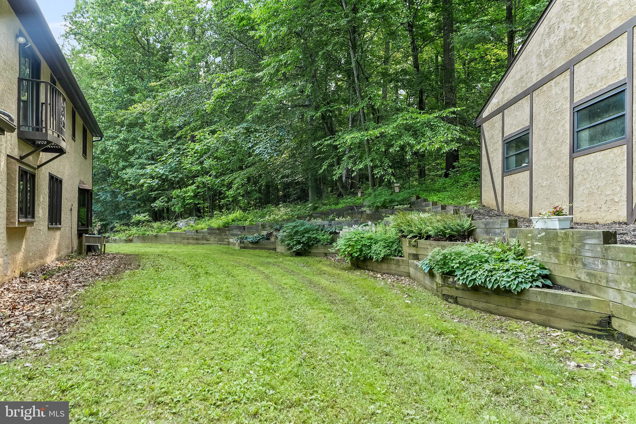 1200 Dunsinane Hill Chester Springs, PA 19425 - Photo 29 of 42 a view of a house with backyard and garden