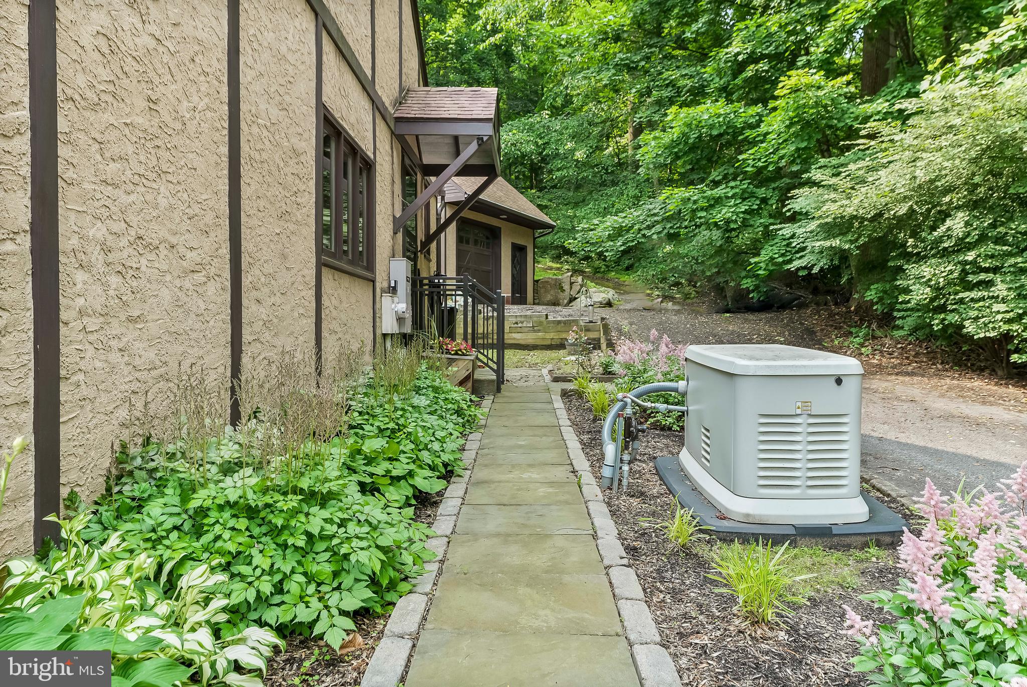1200 Dunsinane Hill Chester Springs, PA 19425 - Photo 34 of 42 a view of house with a yard and potted plants
